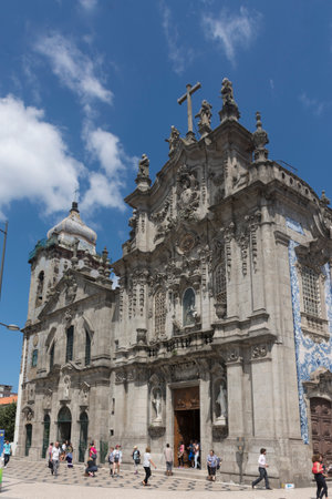 PORTO, PORTUGAL - JULY 20, 2017: Church of Carmo, 18th century, Rococo style, and Carmelite church, 17th century, Baroque style. Both declared National Monument in 2013. Between them, a house 1 meter wideのeditorial素材
