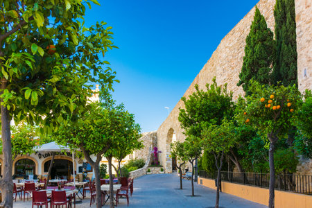 Calpe, Alicante, Spain. May 10, 2019: Bar terrace in a square next to the fortified wall, in the old townのeditorial素材