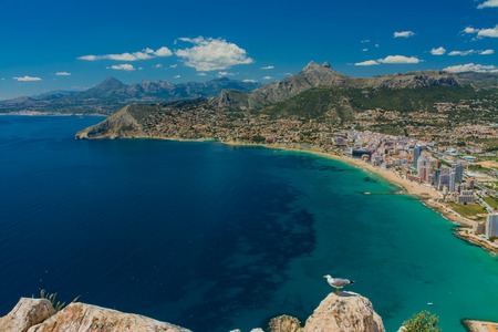 View of the residential area and some hotels in Calpe with the Aitana mountain range at background from the top of the rock of Ifachの写真素材