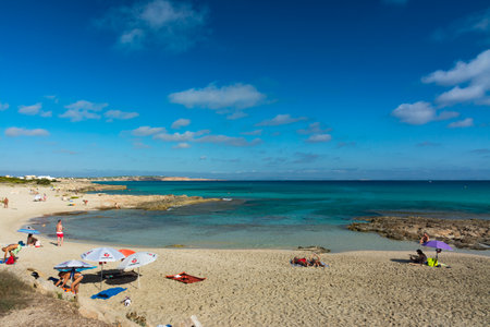 FORMENTERA, SPAIN - SEPTEMBER 12, 2017: Es Calo beach to the northeast, long coastline with coves and rocky areasのeditorial素材