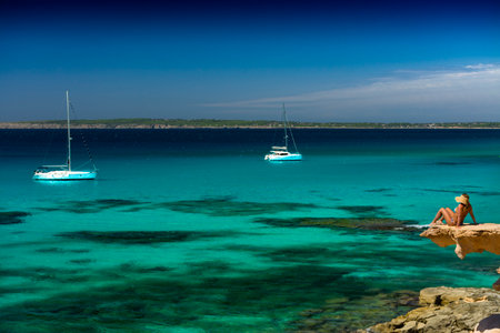 FORMENTERA, SPAIN - SEPTEMBER 12, 2017: Impressive Calo Des Mort cove, at southeast with a small cliff from where to contemplate the transparent waters of its coastのeditorial素材