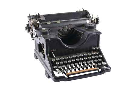 Old black typewriter isolated on white backgroundの写真素材