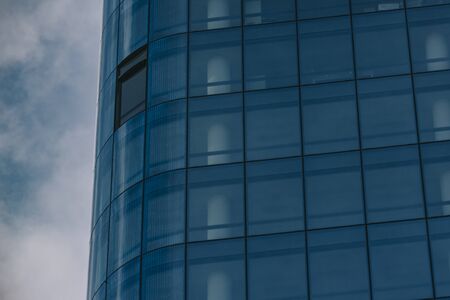 Tall office building with mirror windows, in La Defense business district, Paris, France. Modernity and business conceptの写真素材