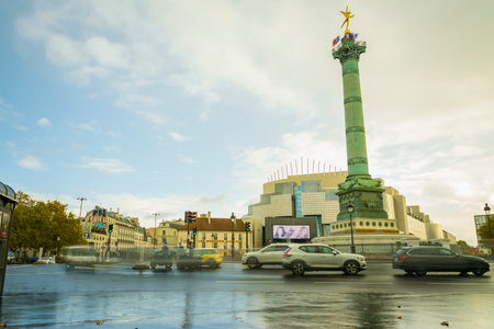Paris, France - November 11, 2019: The column of Jules, monument to the French Revolution, behind him, the Paris Opera, at the Bastille squareのeditorial素材