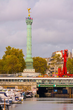 Paris, France - November 11, 2019: Column of the monument to the French Revolution, in the Bastille Square, from the Mornay footbridge, in the Arsenal harbor canalのeditorial素材