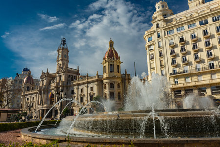Valencia, Spain. February, 24, 2021 - City hall building in the town hall square, with the large fountain in the foregroundのeditorial素材