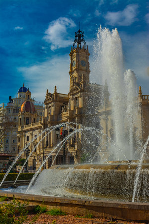Valencia, Spain. February, 24, 2021 - City hall building in the town hall square, with the large fountain in the foregroundのeditorial素材