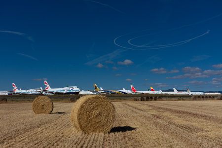 Caude, Teruel, Spain. 13th July, 2021 - Teruel Aerodrome the largest aircraft maintenance, long-term storage and recycling center in Europe. Bales of straw in the fields next to the airport facilitiesのeditorial素材