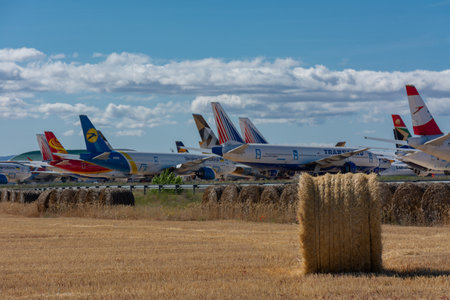 Caude, Teruel, Spain. 13th July, 2021 - Teruel Aerodrome the largest aircraft maintenance, long-term storage and recycling center in Europe. Bales of straw in the fields next to the airport facilitiesのeditorial素材