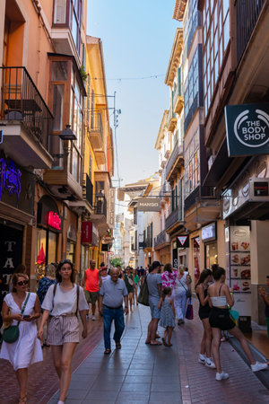 Palma, Mallorca, Balearic Islands, Spain. July 21, 2022 - San Miguel street, narrow pedestrian shopping street, in the old town, busy with people walking and shoppingのeditorial素材