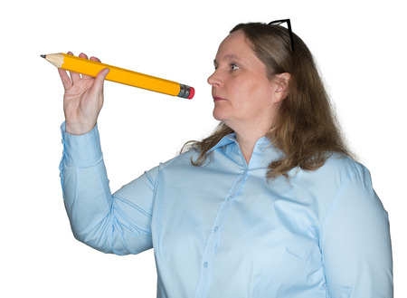 Woman with a pencil in handの写真素材