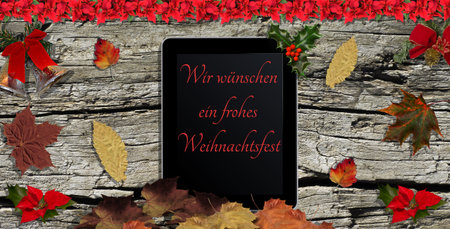 Christmas greeting on a tablet wooden board