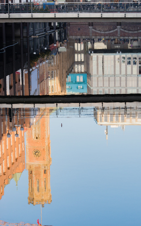 Building reflection in the water at the Pale footbridge in Hamburgの写真素材