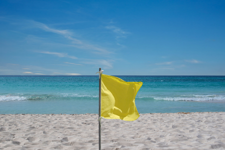 Yellow flag for warning at the beach on Cuba Varaderoの写真素材