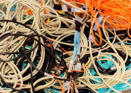 Old network cables and power cables in a pile for disposal