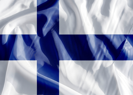 Finland flag on a cloth in close-upの写真素材