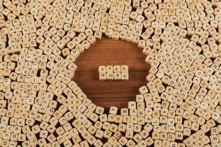 Teamwork Letters cubes on a wooden boardの写真素材