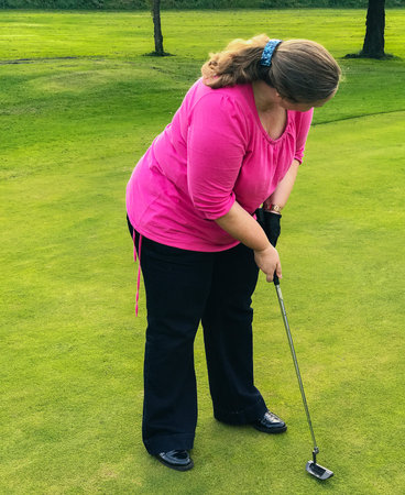 Golf player at tee off on a golf course