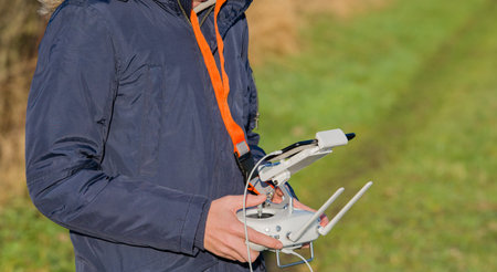operates a remote control for a drone