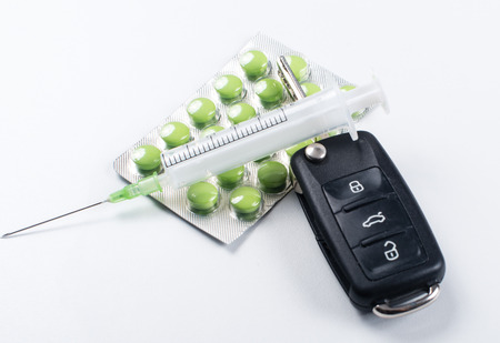 Tablets and car keys on white backgroundの写真素材