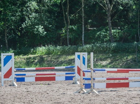 show jumping as a competitive sport with an obstacleの写真素材