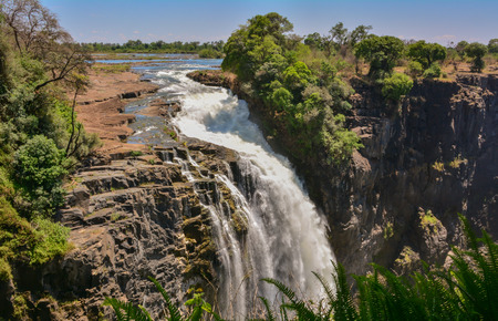 Victoria Falls is a waterfall near the cities of Victoria Falls in Zimbabwe and Livingstone in Zambia Africaの写真素材