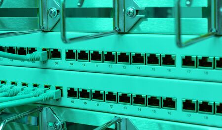 Network switch and network cable in a data centerの写真素材