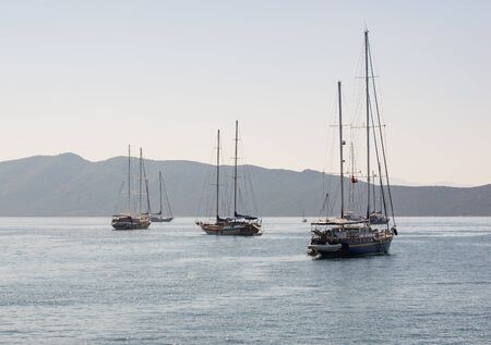 Boats and yachts in the harbor of Bodrum in the country of Turkeyの写真素材
