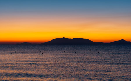Sunrise at 6 o'clock in the morning on the Mediterranean sea in front of Kos Greeceの写真素材