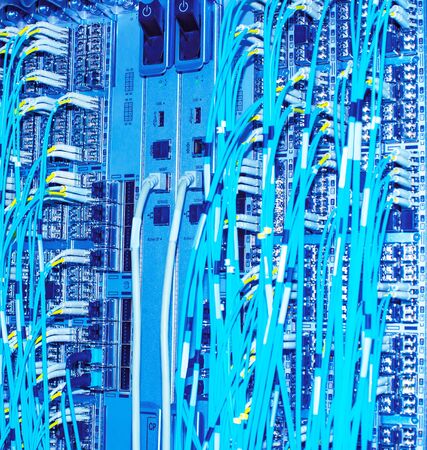 Network switch and network fiber optic fiber in a data centerの写真素材