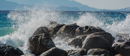 Waves at storm in Mediterranean Sea beating on breakwater on Kos Greeceの写真素材