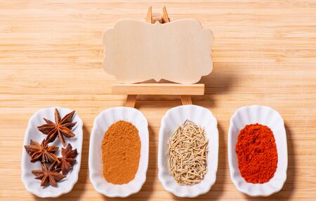 Various spices decorated on a wooden boardの写真素材