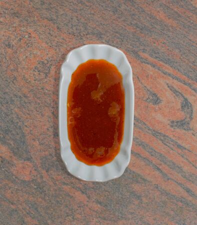 Curry ketchup in a white bowl for food photographyの写真素材