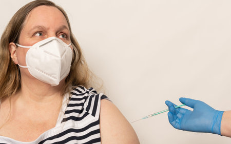 Woman is vaccinated with the vaccine COVID-19 mRNA