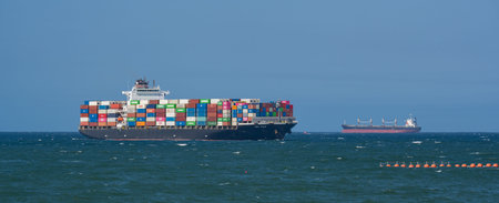 Container ship from the shipping company NYK FUJI with various containers entering the port of...