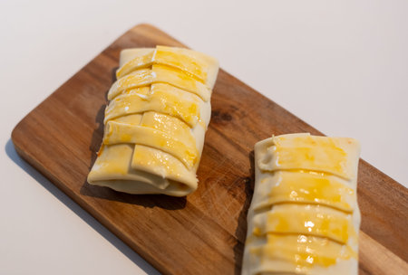 Puff pastry with minced meat filling and egg yolk