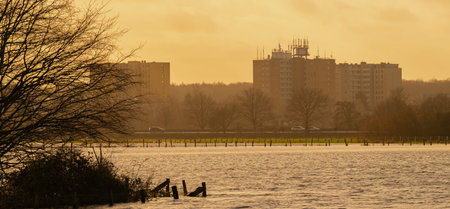 Sunset, fields and meadows flooded after a stormの写真素材