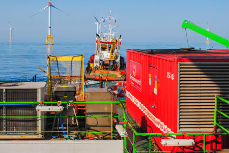 Wind farm offshore energy wind turbine construction on the North Seaの写真素材