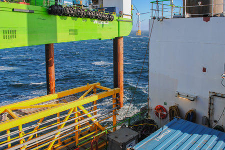 Wind farm offshore energy wind turbine construction on the North Seaの写真素材