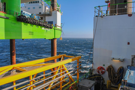 Wind farm offshore energy wind turbine construction on the North Seaの写真素材