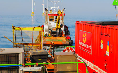 Wind farm offshore energy wind turbine construction on the North Seaの写真素材