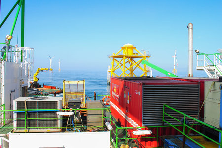 Wind farm offshore energy wind turbine construction on the North Seaの写真素材