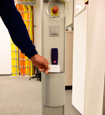 Hold the access card in front of an access system in a data centerの写真素材