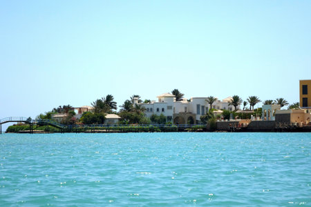 El Gouna, Egypt - July 09, 2017 - Nubian Style Villas Overlooking the Turquoise Waters of El Gouna in Egypts Red Seaのeditorial素材