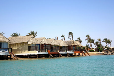 El Gouna, Egypt - July 09, 2017 - Seaside Bungalows With Thatched Roofs at El Gouna Red Sea Egypt Inviting Relaxation on a Sunny Dayのeditorial素材