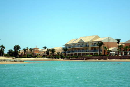 El Gouna, Egypt - July 09, 2017 - Nubian Style Villas Overlooking Tranquil Waters at El Gouna Resort in Egypt on a Sunny Dayのeditorial素材