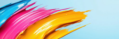 Bright splashes of blue, pink, and yellow paint swirl together on canvas, revealing an explosion of creativity. This artistic expression captivates with its boldness.の素材