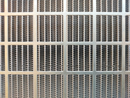 Close-up view of stainless steel mesh featuring a series of interwoven lines and grids, highlighting...