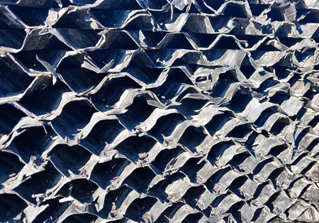 Detailed view of offset corrugated fills used in cooling towers, showing unique structural elements for optimal airflow.の写真素材