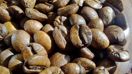 Freshly roasted coffee beans showcase rich textures and deep colors, inviting coffee lovers to brew their favorite beverage in a cozy atmosphere.の写真素材